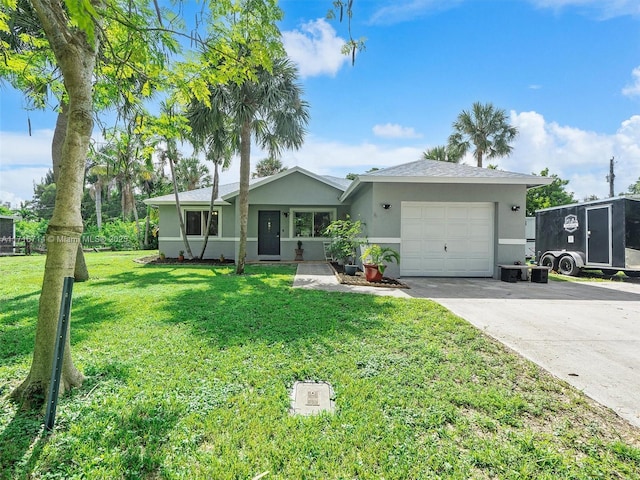 single story home with a front yard and a garage