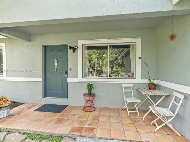 entrance to property featuring a porch