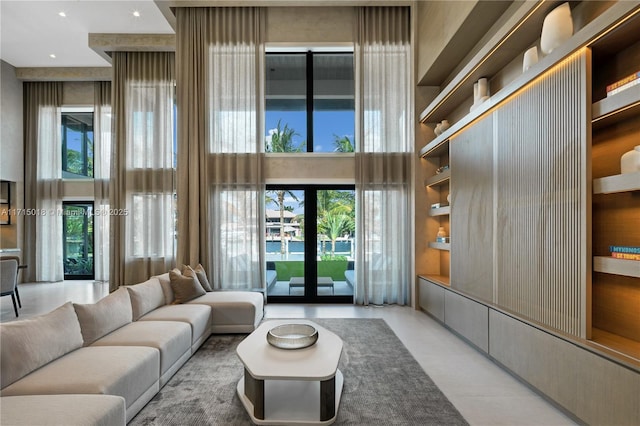 living room featuring french doors and a high ceiling