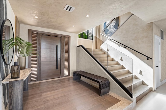 entrance foyer with light hardwood / wood-style floors