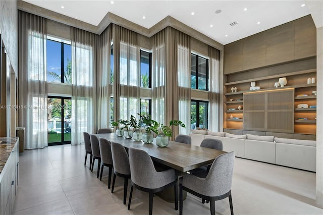 dining space featuring a high ceiling