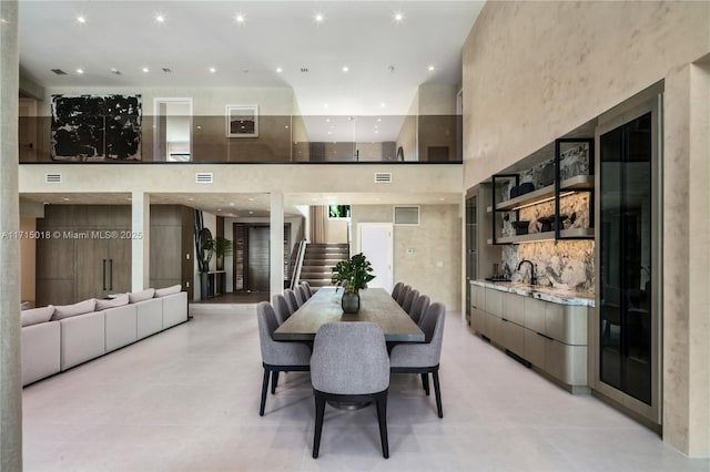 dining room featuring a high ceiling