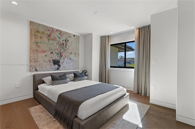 bedroom featuring dark hardwood / wood-style flooring