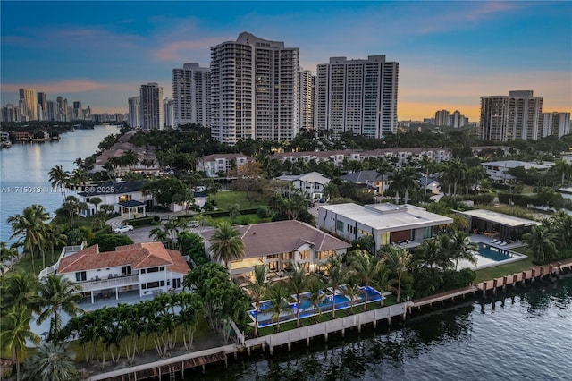 aerial view at dusk with a water view