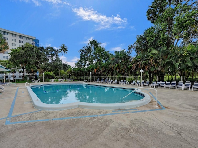 view of pool featuring a patio