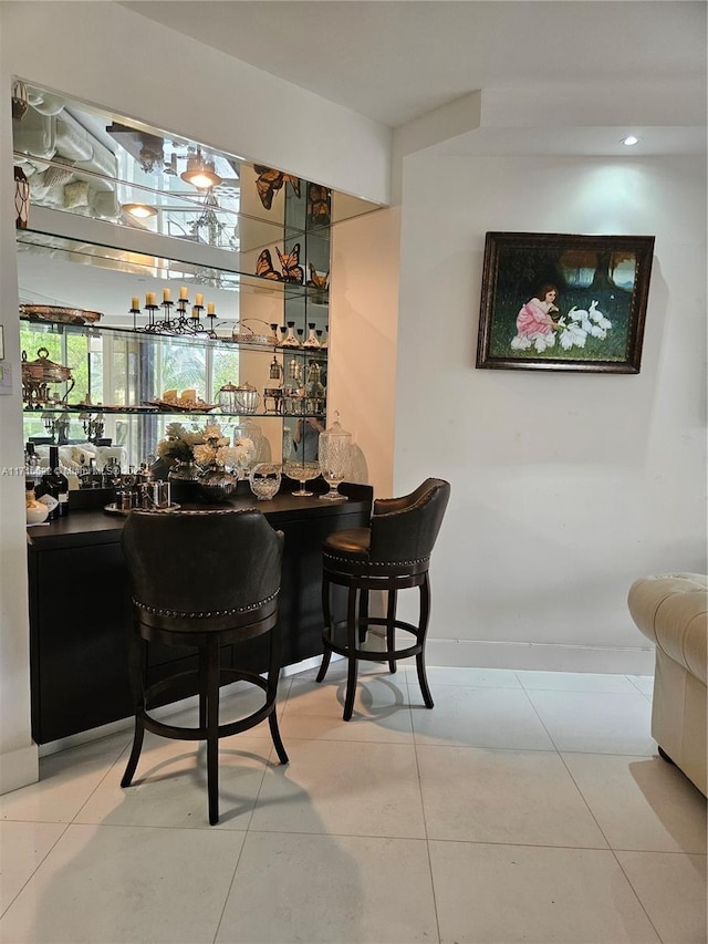 bar with light tile patterned floors