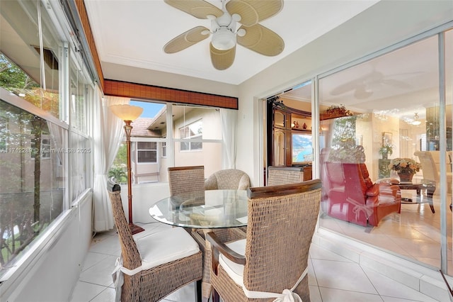 sunroom / solarium featuring ceiling fan