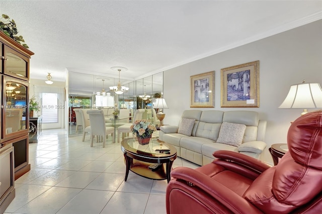 living room featuring light tile patterned floors, a chandelier, a textured ceiling, and ornamental molding