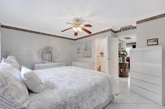 bedroom with ensuite bath, ceiling fan, a textured ceiling, light tile patterned flooring, and ornamental molding