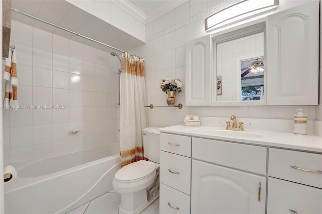 full bathroom with vanity, crown molding, ceiling fan, toilet, and shower / tub combo