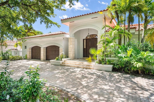 mediterranean / spanish-style house featuring a garage