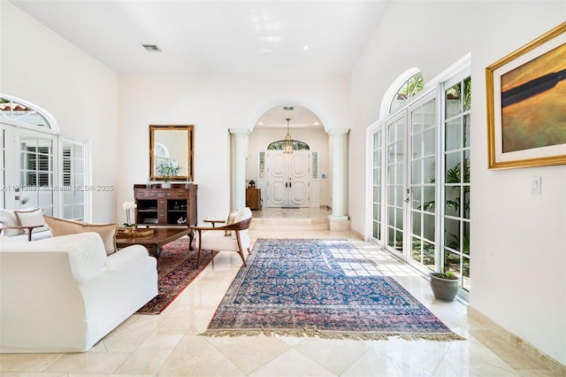 living room featuring decorative columns