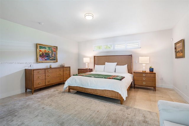 bedroom featuring light tile patterned flooring