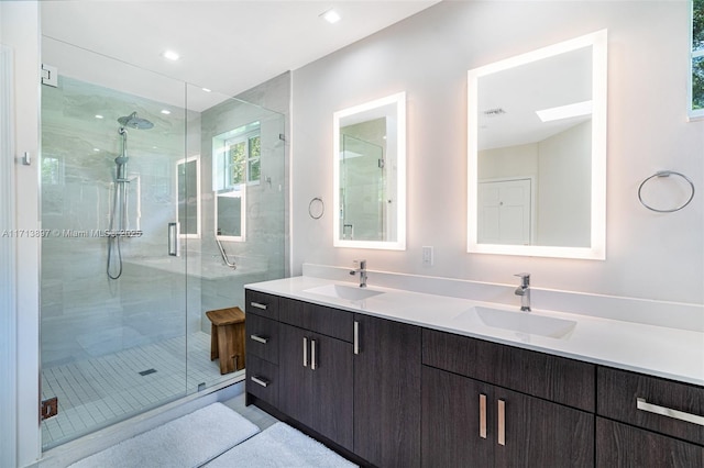 bathroom with vanity and an enclosed shower