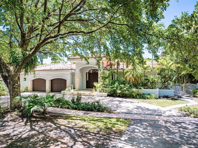 mediterranean / spanish-style home featuring a garage