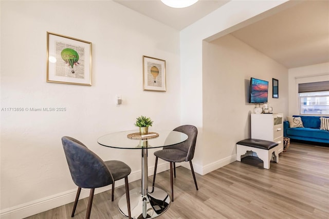 dining area featuring light wood-type flooring