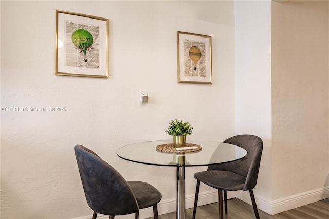 dining space featuring hardwood / wood-style floors