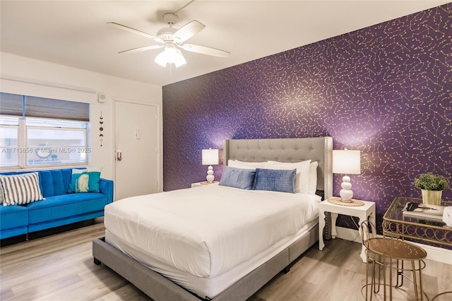 bedroom with ceiling fan and hardwood / wood-style floors