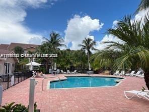 view of pool featuring a patio area