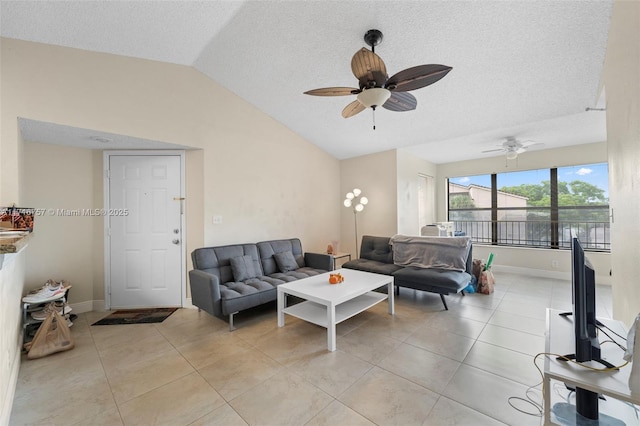 living room with light tile patterned floors, a textured ceiling, vaulted ceiling, and ceiling fan