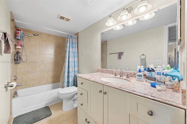 full bathroom featuring tile patterned floors, shower / bath combination with curtain, toilet, and vanity