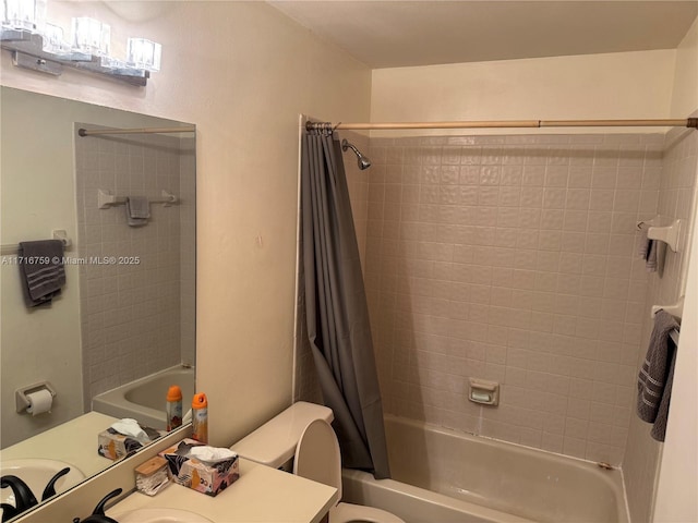 full bathroom with toilet, shower / tub combo with curtain, and sink