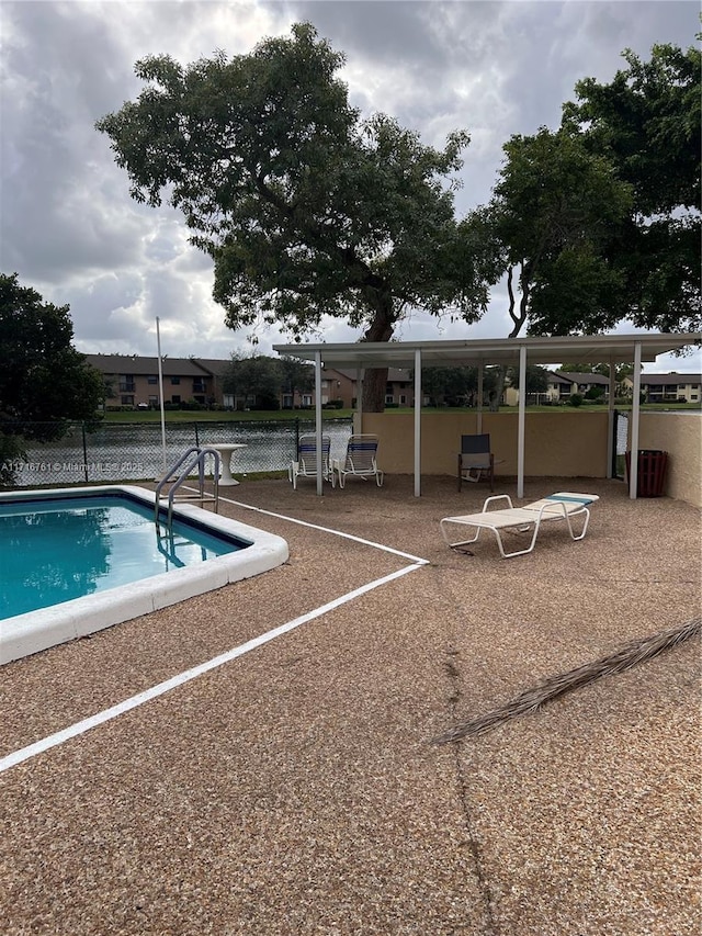 view of swimming pool with a patio area