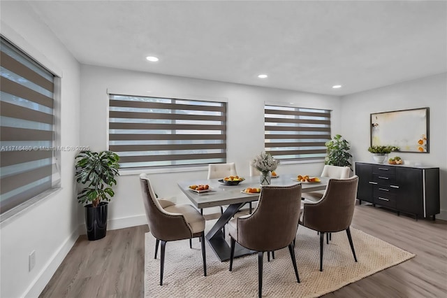 dining area with light hardwood / wood-style floors