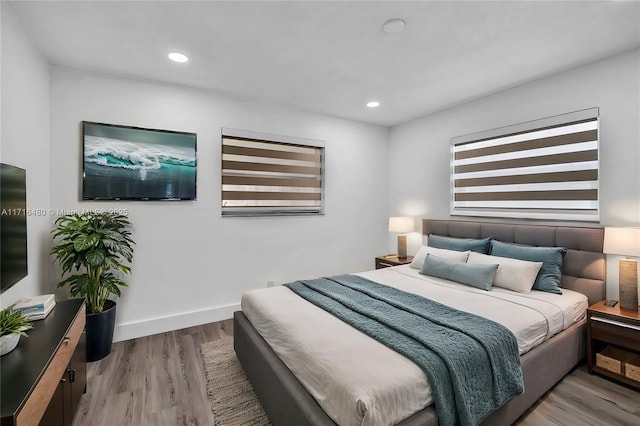 bedroom with light wood-type flooring