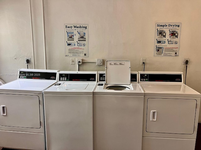 washroom with washer and dryer