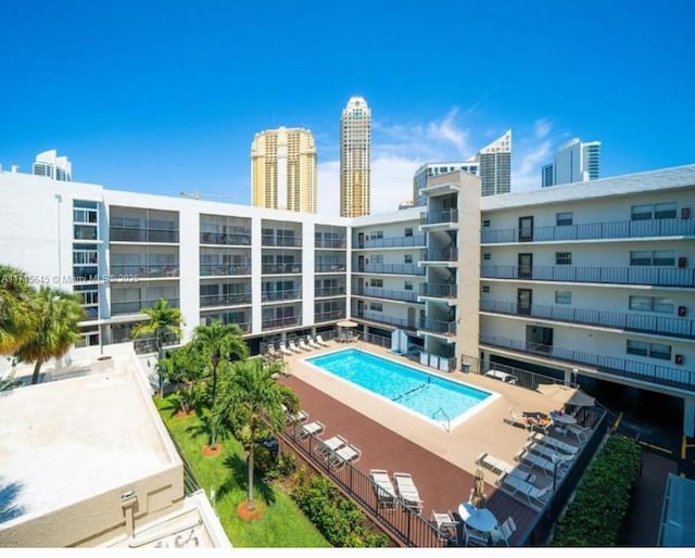 view of swimming pool with a patio