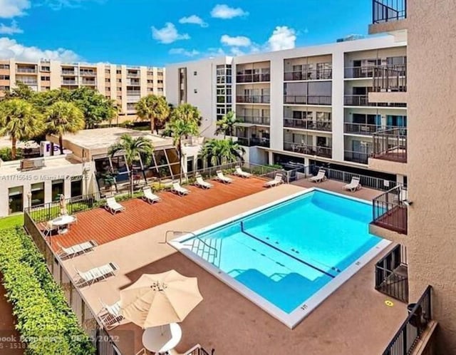 view of swimming pool with a patio