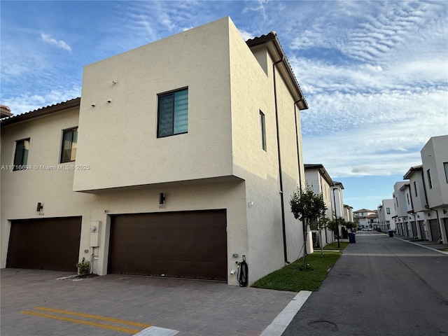 view of side of property featuring a garage