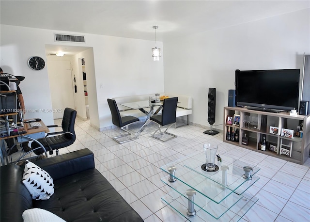 living room with light tile patterned floors