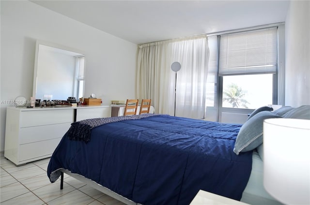 bedroom with light tile patterned floors