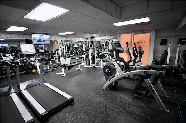 gym featuring a paneled ceiling