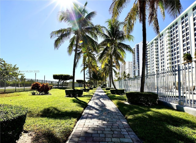 surrounding community featuring a lawn