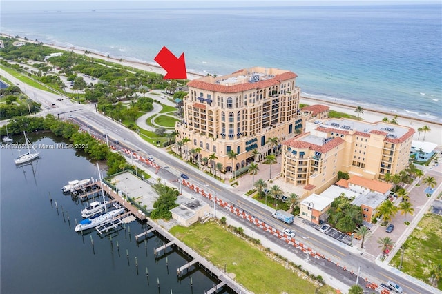 bird's eye view featuring a view of the beach and a water view