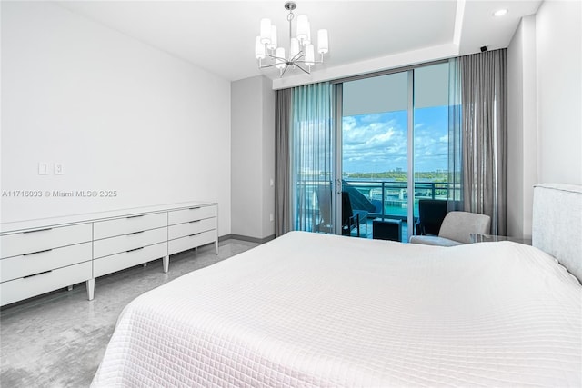 bedroom featuring access to outside and a notable chandelier