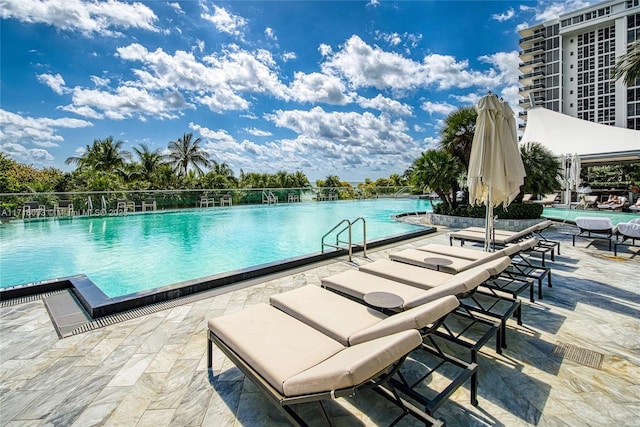 view of swimming pool with a patio area