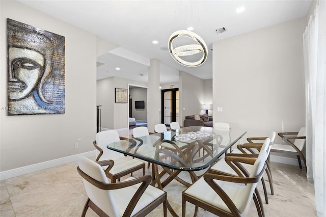 kitchen with premium range hood, decorative light fixtures, an island with sink, appliances with stainless steel finishes, and sink