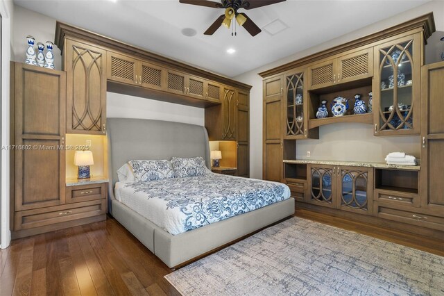 bedroom featuring ceiling fan and dark hardwood / wood-style flooring