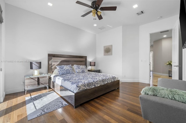 bedroom with ceiling fan and dark hardwood / wood-style floors