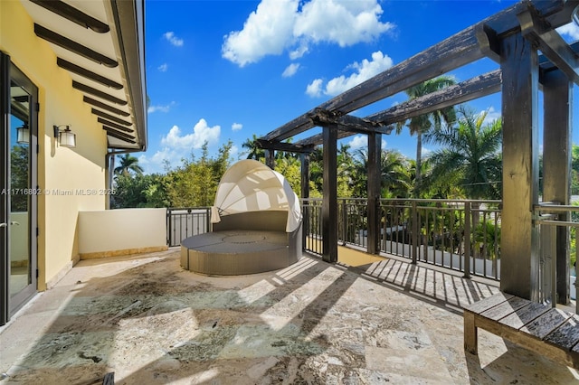 view of patio featuring a balcony