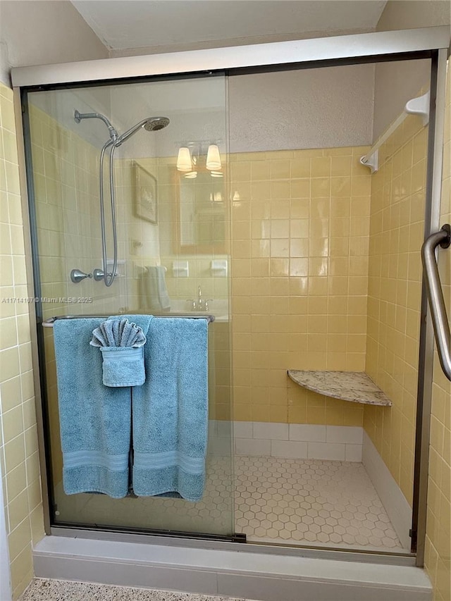 bathroom with a shower with shower door