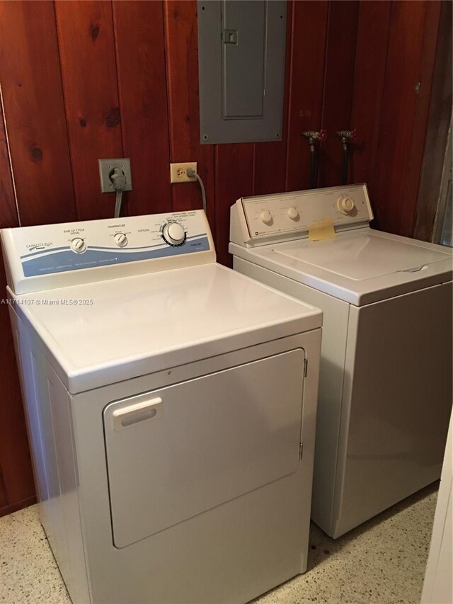 washroom with washing machine and dryer and electric panel