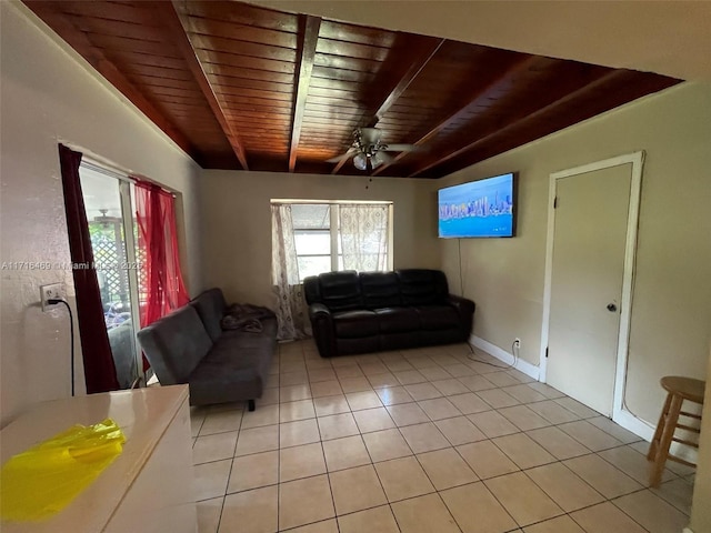 living room featuring ceiling fan, light tile patterned flooring, wooden ceiling, and a healthy amount of sunlight