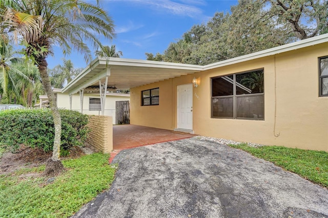 view of front of home with a carport