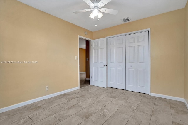 unfurnished bedroom featuring a closet and ceiling fan