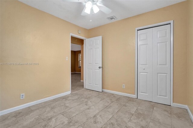 unfurnished room with ceiling fan